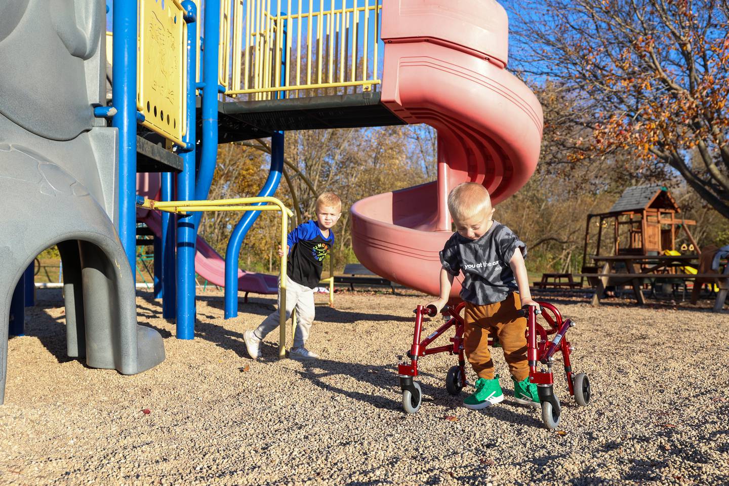 Bedford Erickson, 2.5, right, navigates the playground with his brother, Link, 4, at Grace Christian Academy on Nov. 7, 2025. Bedford, who was born with Schwartz-Jampel Syndrome, was selected for a fundraiser to bring an inclusive playground to the school, where he'll start next year.