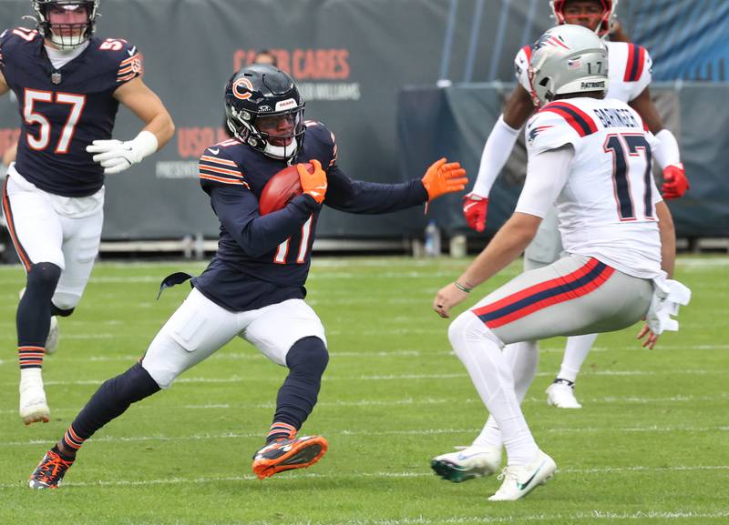 Chicago Bears wide receiver DeAndre Carter looks to get by New England Patriots punter Bryce Baringer as he returns a punt during their game Sunday, Nov. 10, 2024, at Soldier Field in Chicago.