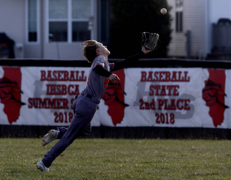 McHenry’s Landon Clements tries to catch a fly ball hit by Huntley's Jack Ezell during a Fox Valley Conference baseball game on Friday, April 11, 2025, at Huntley High School.