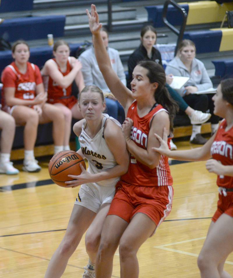 Polo's Carlee Grobe (3) drives the baseline as Oregon's Sarah Eckardt (13) defends during Tuesday, Dec. 5, 2023 action at Polo High School.