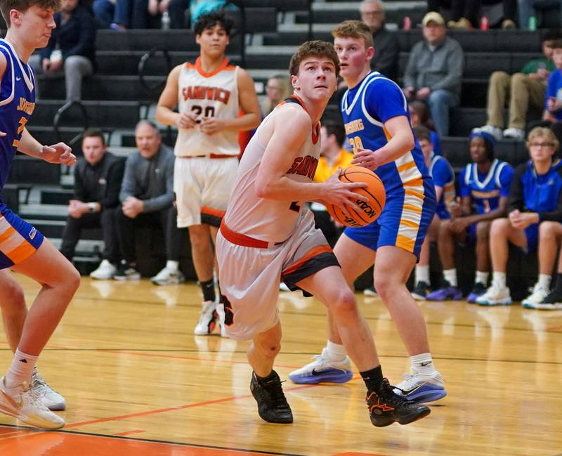 Sandwich's Griffin Somlock (2) drives to the hoop against Johnsburg during a basketball game at Sandwich High School on Friday, January 31, 2025.