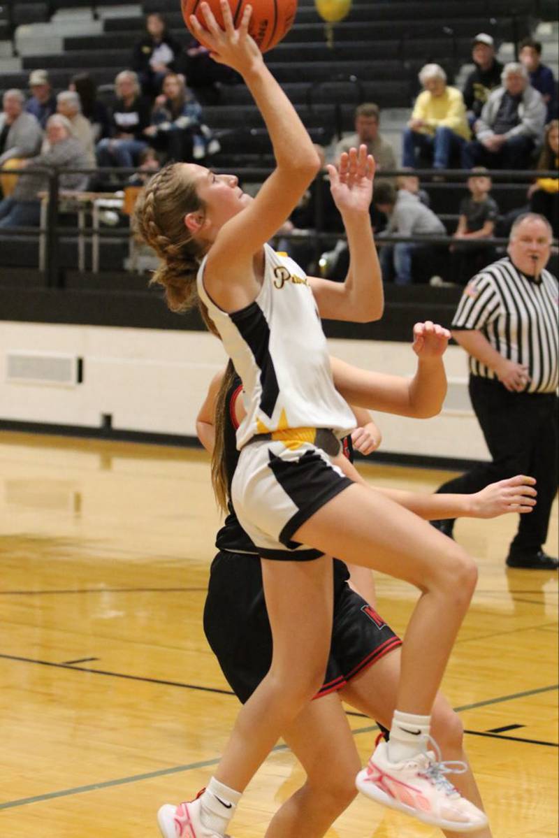 PC's Anni Judd takes in a layup in Tuesday's Putnam County 8th grade night. The Pumas beat Marseilles 51-15.