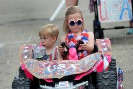 Kids show their rides and patriotic colors at Let Freedom Ring Kiddie Parade