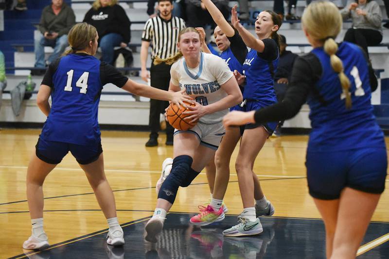 Cissna Park's Addison Lucht, center, drives through the Clifton Central defense during a game at Cissna Park Wednesday, Feb. 4, 2026.