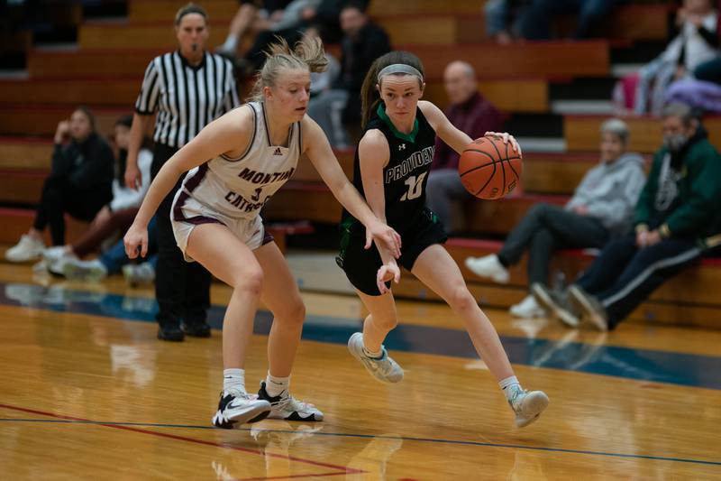 Providence's Molly Knight (10) drives to the basket against Montini's Victoria Matulevicius (5) during the 3A Glenbard South Sectional basketball final at Glenbard South High School in Glen Ellyn on Thursday, Feb 23, 2023.