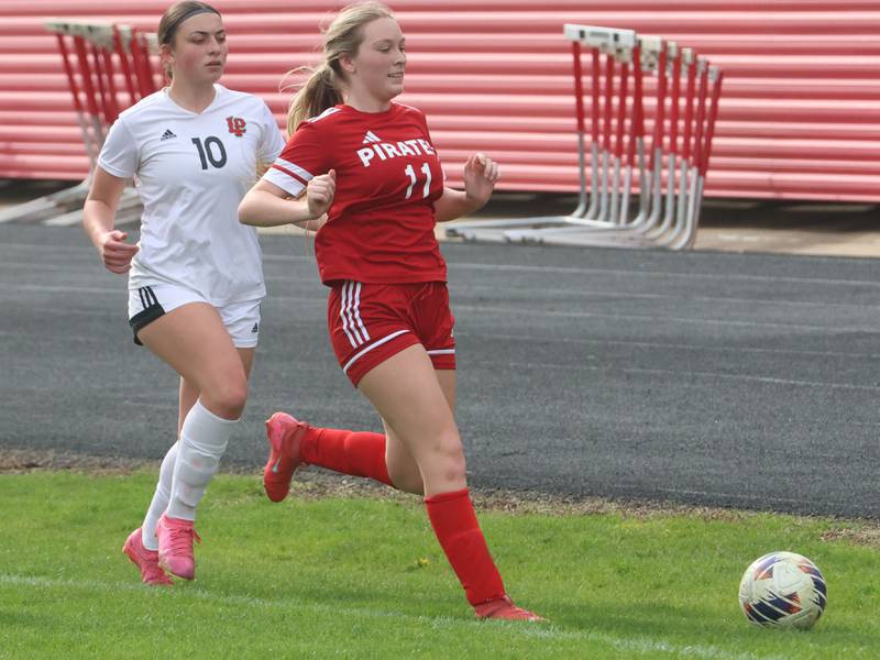 L-P's Kendal Bassett and Ottawa's Gracie Polancic chase after the ball on Monday, April 13, 2026 on King Field at Ottawa High School.