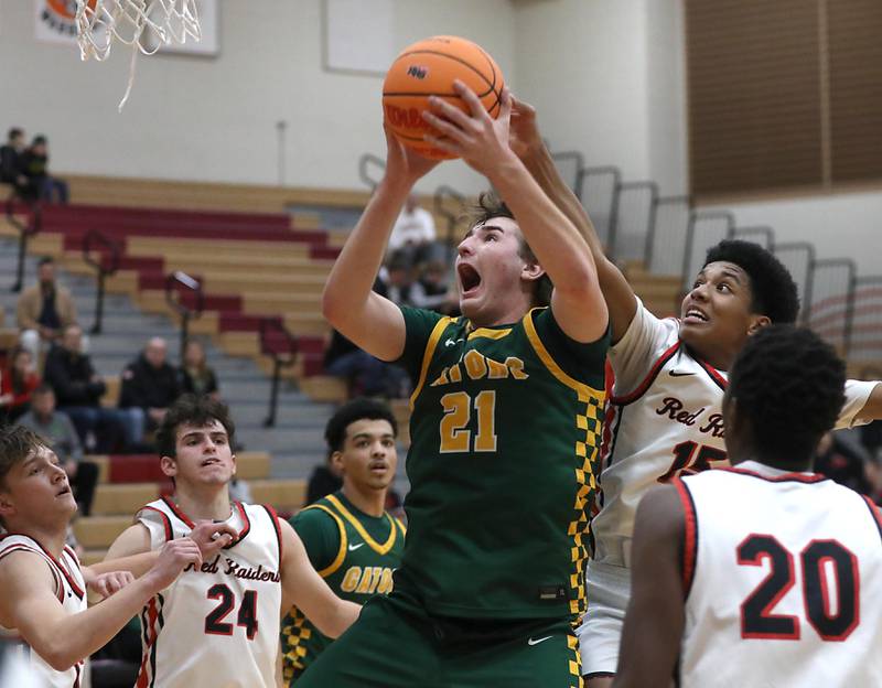 Crystal Lake South's Ryan Morgan grabs a rebound in front of Huntley's Isaac Muze during a Fox Valley Conference boys basketball game on Wednesday, Dec. 10, 2025, at Huntley High School.