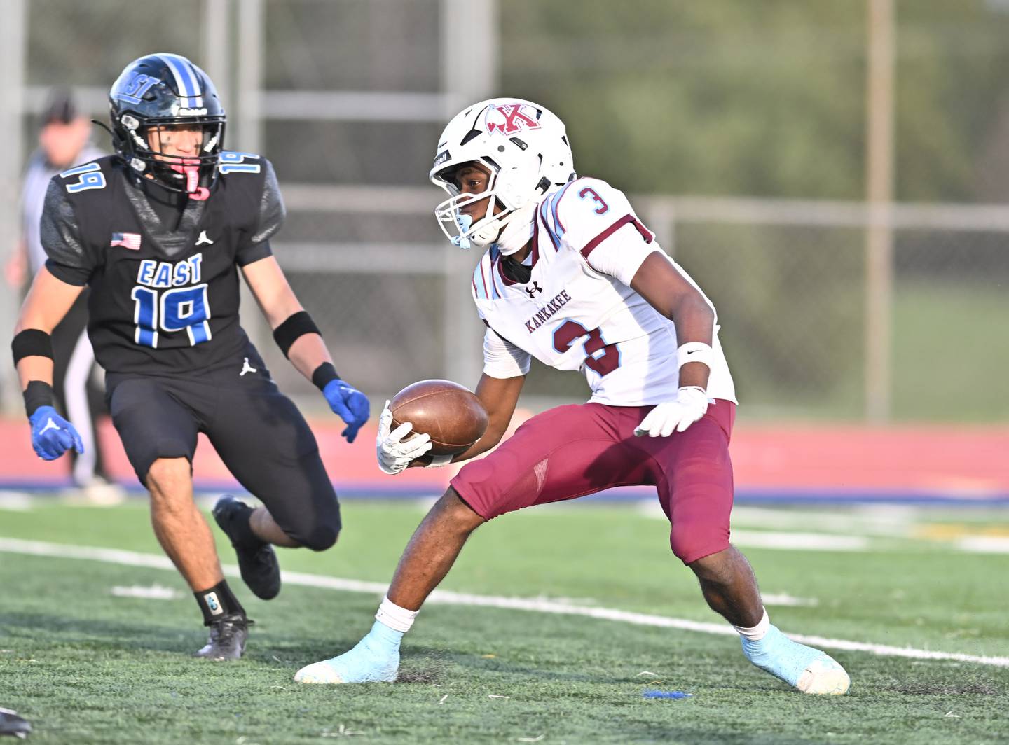 Kankakee's Cedric Terrell (3) attempts to return a kickoff during the non-conference game against Lincoln Way East on Friday, Sept. 05, 2025, at Frankfort.
