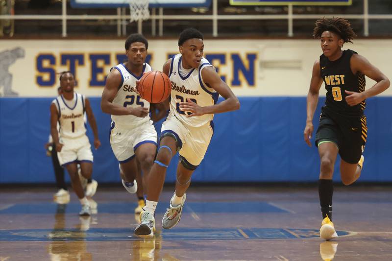 Joliet Central’s Danny Thompson works the ball upcourt against Joliet West on Saturday, Jan. 27th, 2024 in Joliet.