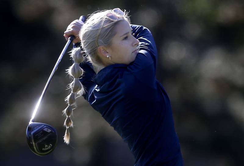 Sterling’s Carmen Camacho watches her tee shot on the first hole during the IHSA Class 2A Huntley Girls Golf Regional on Tuesday, Oct. 1, 2024, at Pinecrest Golf Club in Huntley.