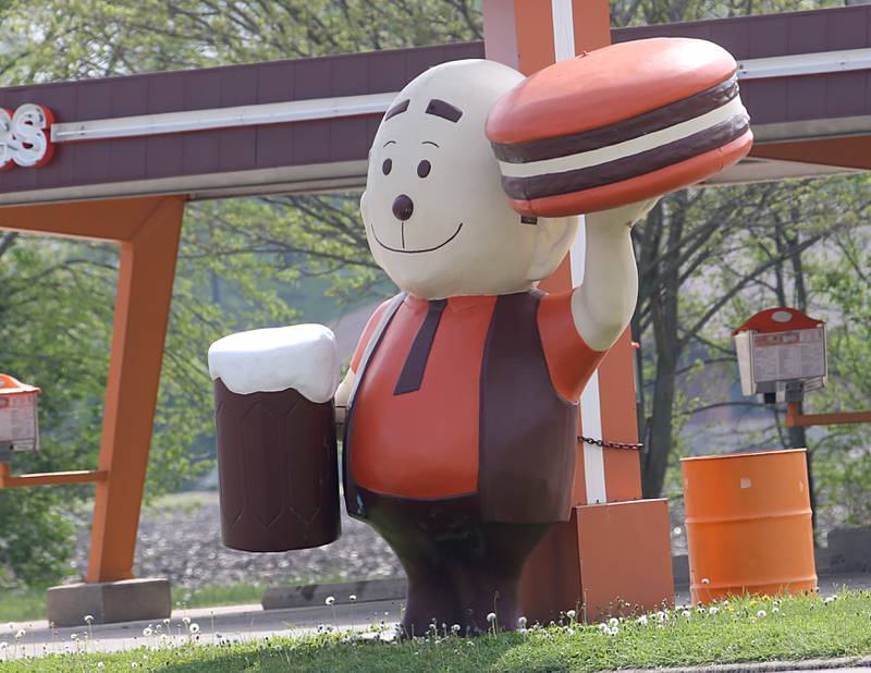 Woody the Rootbeer Man greets visitors at the Rootbeer Stand on Monday, May 8, 2023 in Oglesby. Woody is a A&W Papa Burger statue from the 1960's. Woody, stands about 8 feet tall and weighs 300 pounds. Woody was from Woody’s Drive-In in Streator. He moved to the Rootbeer Stand after the restaurant closed it's doors in 2005.