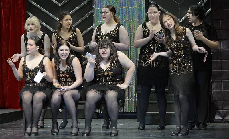 Streator High School students (back row left to right) L Smith as Hunyak; Luciana Gauna as June; Maddy Reum as Kitty; Lily Basina, Damian Roldan as Harry; (front) Kylie Cook as Liz; Natalie Hudson as court clerk; Joeylynn Arkels as Martin Harrison; and Allison Smith rehearse a scene from their spring musical "Chicago."