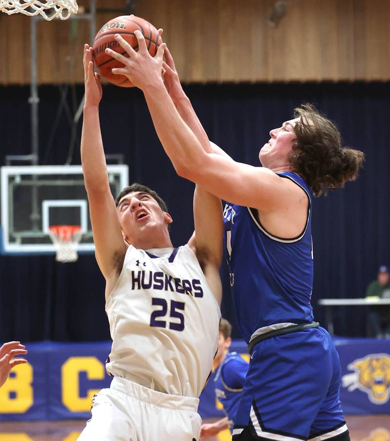 Serena's Richie Armour and Hinckley-Big Rock's Martin Ledbetter go after a rebound Friday, Feb. 3, 2023, during the championship game of the Little 10 Conference Basketball Tournament at Somonauk High School.