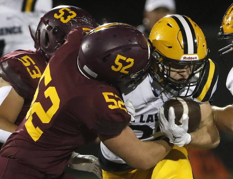 Richmond-Burton's Adam Schuler tackles St. Laurence's Harley Rizzs during an IHSA Class 4A first-round football game on Friday, Nov. 1, 2024, at Richmond-Burton High School in Richmond.