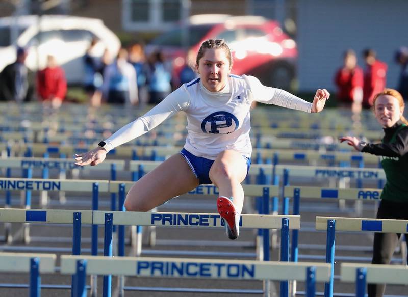 Princeton's Miyah Fox clears a hurdle in Thursday's Howard-Monier Girls Invitational at Princeton.