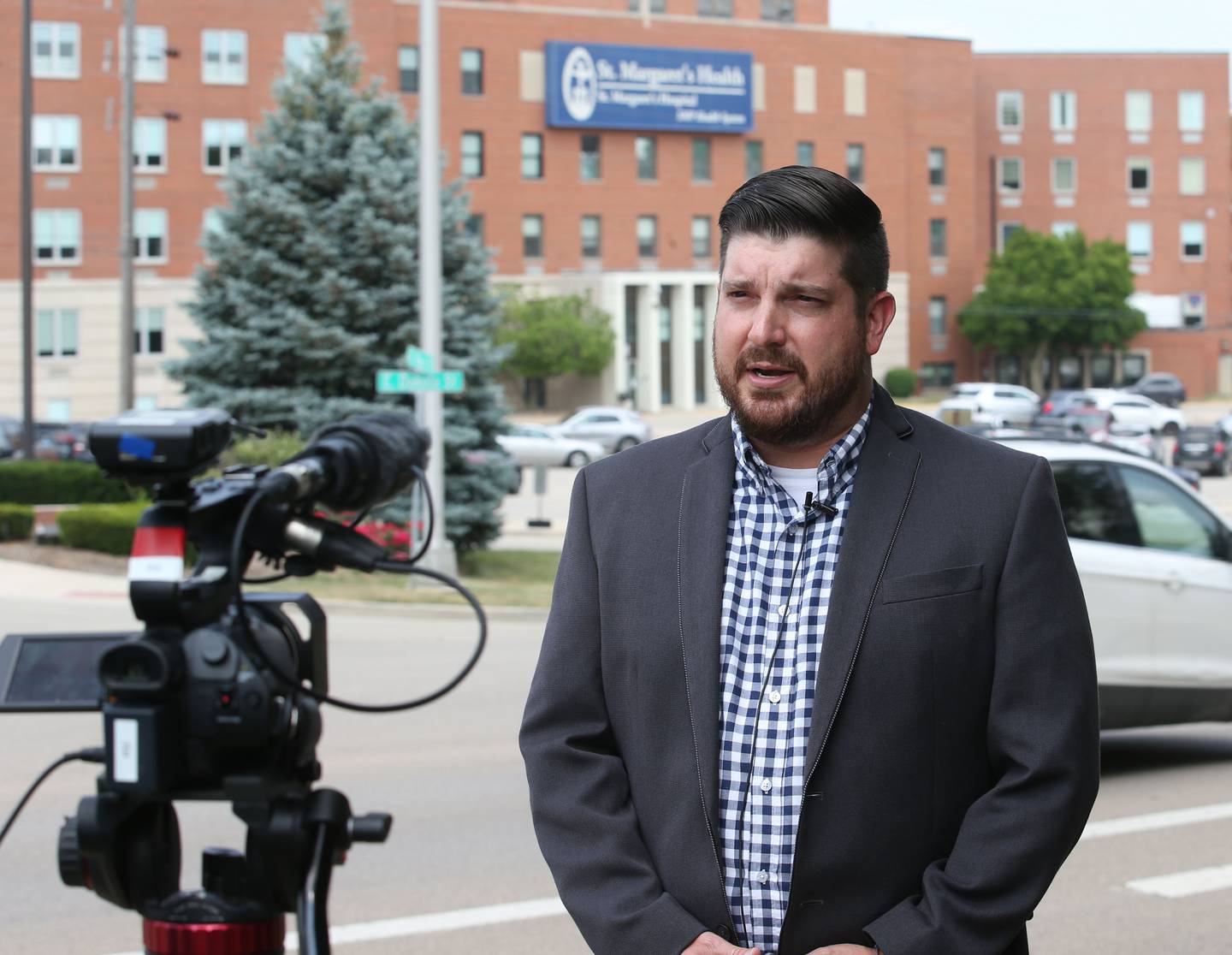 Bill Zens, executive director of the Illinois Valley Area Chamber of Commerce speaks to reporters outside St. Margaret's Healthcare on Friday, June 16, 2023 in Spring Valley. Around 1,100 employees are affected after the closure of both the Peru and Spring Valley facilities.