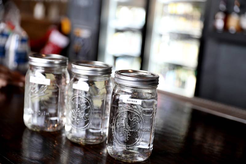 Water samples from the City of Batavia wait to be tasted in a blind taste test during the annual Kane County Water Association's annual water-tasting contest at Global Brew in St. Charles on Thursday, Dec. 21, 2023.