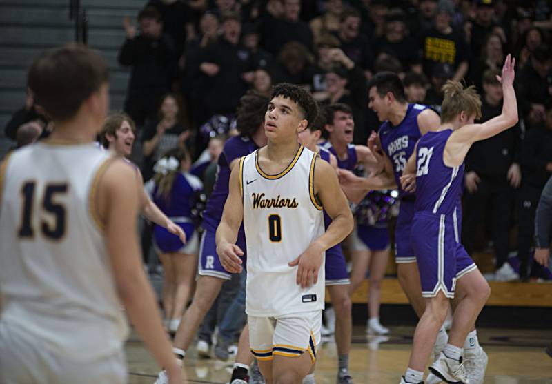 Sterling's Andre Klaver walks off the court following the Warriors' 84-70 loss against Rochelle in the regional finals Friday, Feb. 25, 20212.