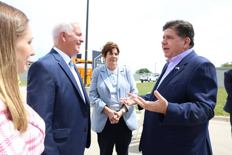 State Sen. Rachel Ventura, D-Joliet, left, Joliet Mayor Terry D’Arcy and Will County Executive Jennifer Bertino-Tarrant listen to Governor JB Pritzker talk at the construction kickoff for the new Interstate 80 Des Plaines River bridges on Friday, May 20, 2026 in Joliet.