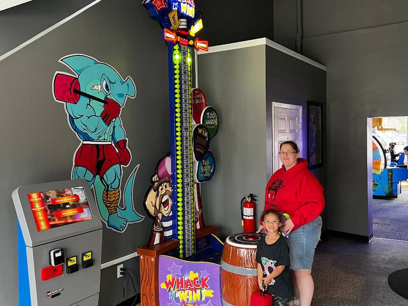Amanda Peppers of Rock Falls brings her daughter, Ivy Peppers, 4, to try the games at Aubree's Fun World.