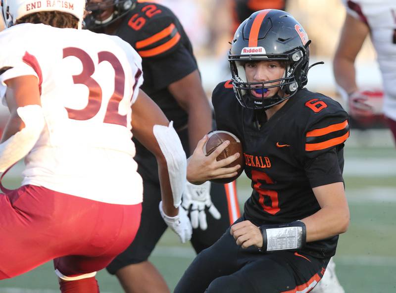 DeKalb quarterback Joshua Klemm finds a hole in the Belleville West defense during their game Friday, Sep. 10, 2021 at DeKalb High School.