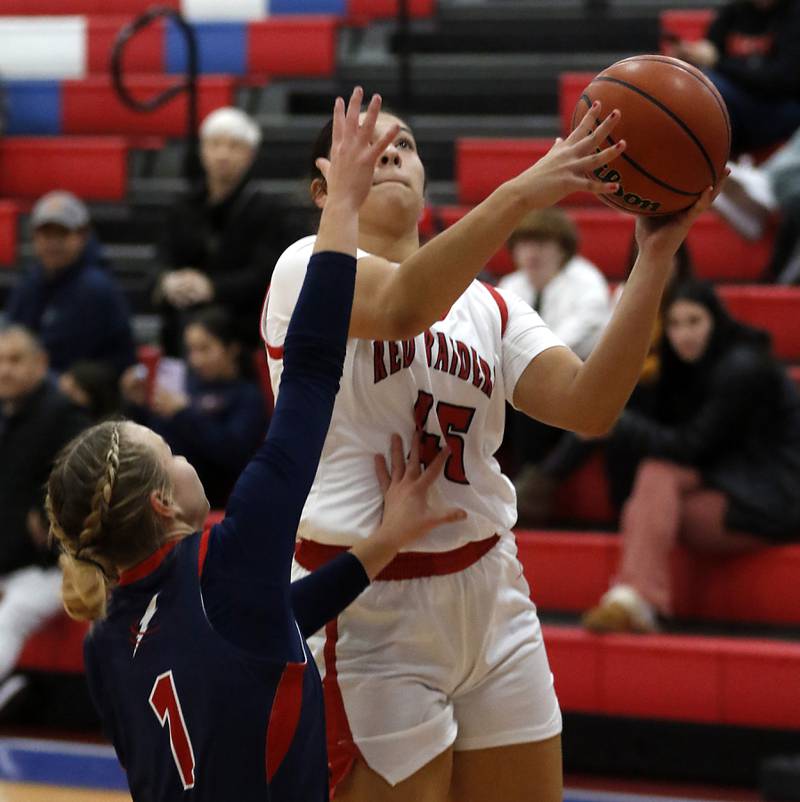Huntley’s Madison Diaz drives to the basket against South Elgin’s Addison Tinerella on Tuesday, Nov. 21, 2023, during a basketball game in the Dundee-Crown High School Girls Thanksgiving Tournament in Carpentersville.
