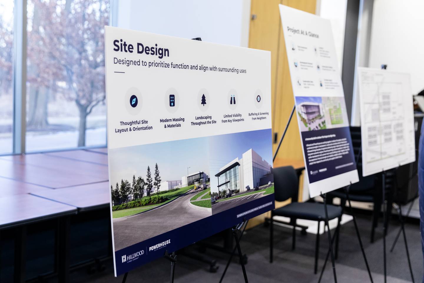 The proposed Joliet Technology Center project plans and informational posters are on display during a community open house event at Joliet Community College on Feb. 12, 2026.