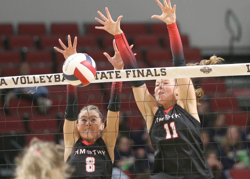 Timothy Christian's Elizabeth Alex and teammate Ella Rickert block a spike from Bloomington Central Catholic during the Class 2A State semifinal game on Friday, Nov. 15, 2024 at CEFCU Arena in Normal.