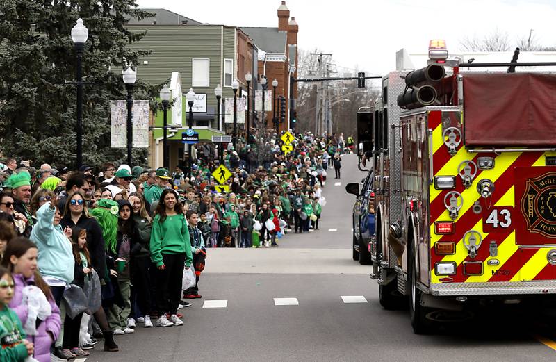People line Green Street in McHenry for the McHenry ShamROCKS the Fox Festival Parade on Saturday, March 16, 2024.