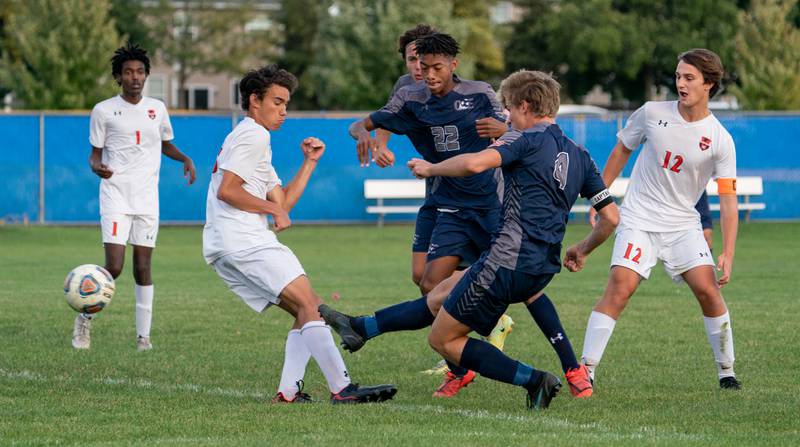 Oswego East's Drew Karg (4) shoots the ball for a goal against Oswego during a soccer match at Oswego East High School on Monday, Sep 26, 2022.