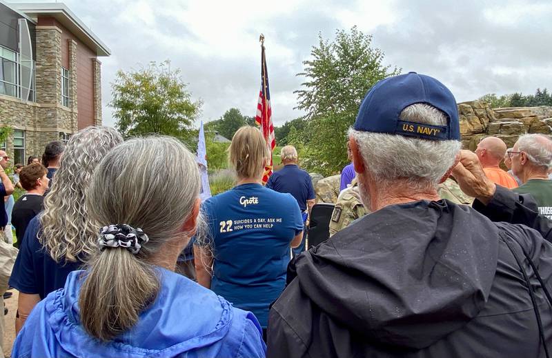 A U.S. Navy veteran salutes as the national anthem is sung to start the inaugural Be the One Walk, an event to combat veteran suicide rates. Organized by the DeKalb American Legion Post No. 66, the walk began at Northwestern Medicine Health and Wellness Center, 626 Bethany Road, DeKalb, on Sunday, Sept. 22, 2024.