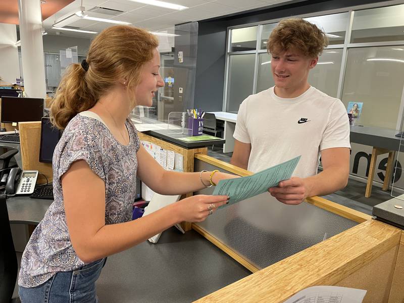 Admissions worker Maddison Gentry registers incoming freshman Jenson Ketcham recently. Ketcham, a 2022 Streator High School graduate, will study Emergency Medical Services (EMS) at Illinois Valley Community College.