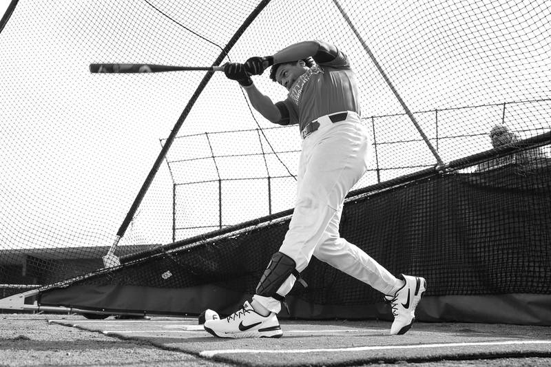 Plainfield East’s Christian Mitchelle takes his turn in the batting cages as Plainfield East holds their first outdoor practice. Monday, Mar. 14, 2022, in Plainfield.