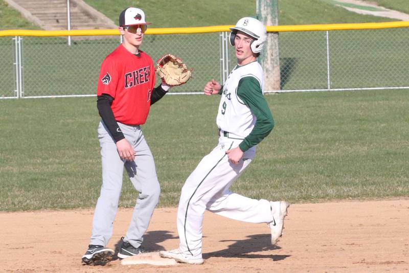 Spring Creeks's Dominik Nelson waves off a throw to second base as St. Bede's Ryan Slingsby reaches the bag safely on Thursday, March 28, 2024 at St. Bede Academy.