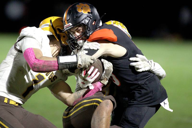 Crystal Lake Central’s Casen Noennig is wrapped up against Jacobs in varsity football at Metcalf Field on the campus of Crystal Lake Central Friday night.