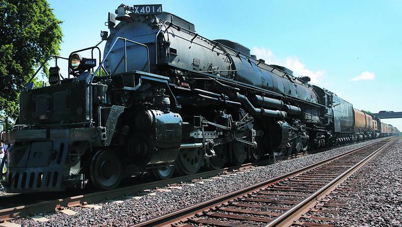 Full steam ahead. The worlds largest steam engine known as "Big Boy," No. 4014 enters Railroad park in Rochelle on Tuesday. The locomotive was built for Union Pacific Railroad in 1941. It was restored in 2016 and is now traveling across the United States in honor of the 150th anniversary of the Transcontinental Railroad. The locomotive weights 1.2 million pounds and is 132 feet in length. The boiler holds 24,000 gallons of water. Only eight "Big Boy" locomotives are in existence and No. 4014 is the world's only operating "Big Boy" locomotive. (7-30-19)