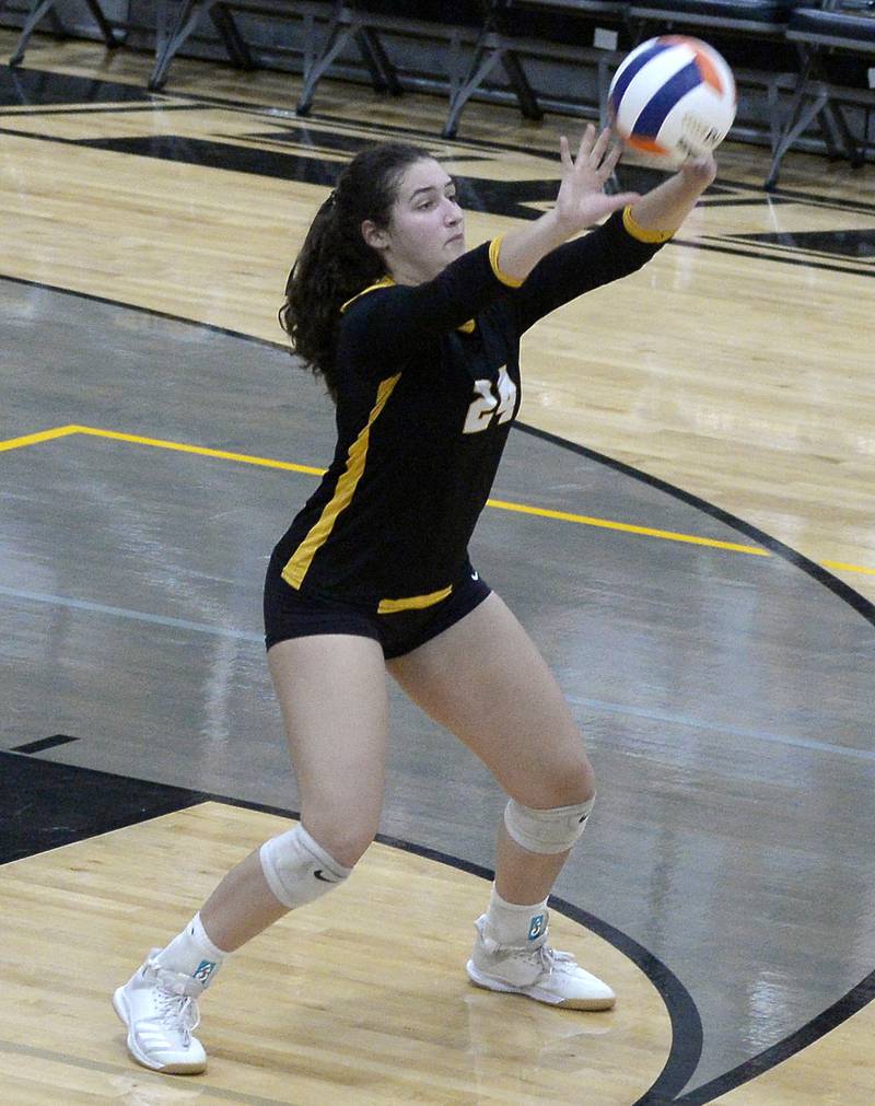 Putnam County's Maggie Richetta sends a serve toward the net Thursday, Aug. 25, 2022, in Granville.