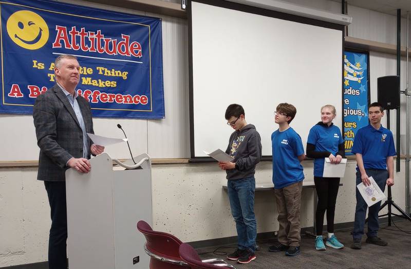 Geneva High School students Quentin Yung (left) Ryan Barrett, Marissa DeYoung and Pablo Drab accept District 304’s first Viking Leadership Award from Principal Tom Rogers at the Dec. 11 meeting. Cailla Swanson, at far right, teaches the Vocational Exploration class. Other students in her class, also honored, but not present were Brody Dihl, Isabelle Hauth and Jesus Villa Ortiz.