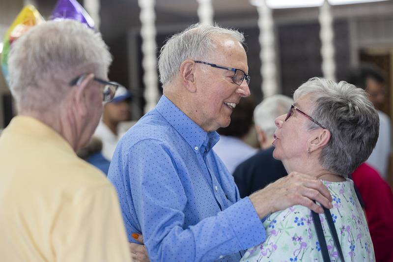 Diane Schoaf congratulates Dick Dir on his retirement Monday, March 30, 2026, during an open house for the long time barber at Bill and Dick’s Barbershop in downtown Dixon. After 61 years and thousands of haircuts, Dir is calling it a career.