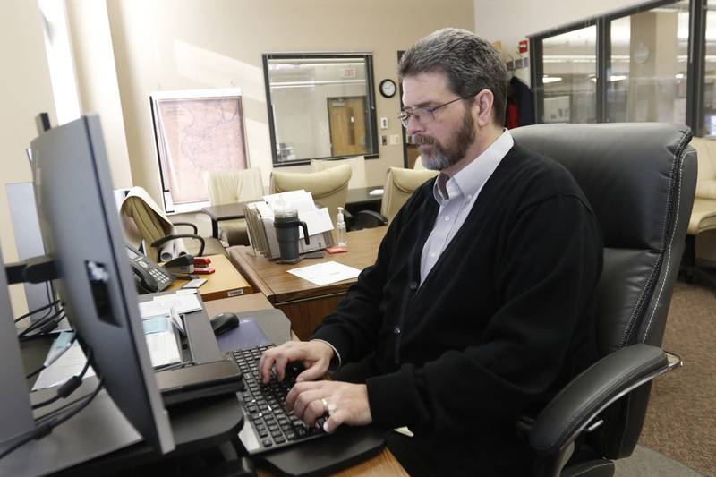 McHenry County Clerk Joe Tirio works in his office the morning of Thursday, Jan. 20, 2022, in Woodstock, the day after the Illinois Supreme Court heard oral arguments in McHenry Township's court case against the Clerk's Office over the township's 2020 abolition attempt.