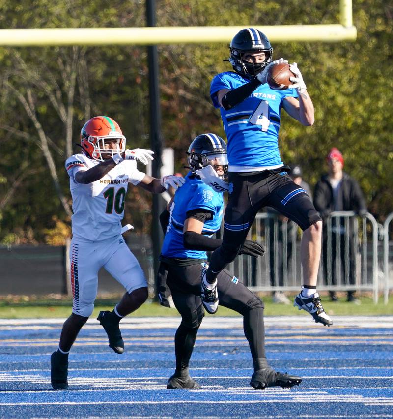St. Francis' Zach Washington (4) intercepts a pass against Morgan Park during a class 5A state quarterfinal football game at St. Francis High School in Wheaton on Saturday, Nov 11, 2023.