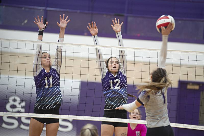 Dixon’s Ella Govig (left) and Dixon’s Joey Brumbly go for for the block against Rockford Lutheran’s Sami Spangler Tuesday, Sept. 20, 2022.