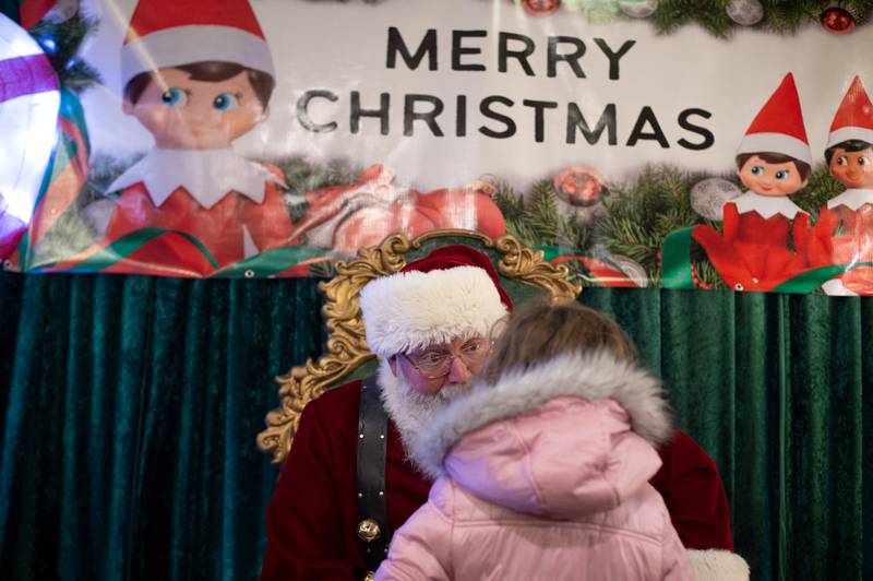 Santa Claus finds out what a little girl wants for Christmas at the Kankakee Train Depot on Thursday, December 4, 2025.