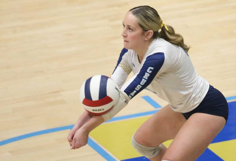 Marquette libero Carissa Blood returns a serve from Serena on Wednesday, Oct. 22, 2025 in Bader Gymnasium at Marquette High School.