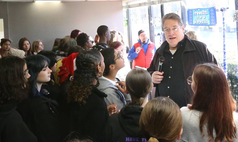 Fox 32 Chicago meteorologist Mark Strehl talks to students from Shepard Middle School during the annual Freezin' for a Reezin' event on Friday, Dec. 6, at WCMY in Ottawa. The all-day event to helps the Ottawa Community Food Basket.