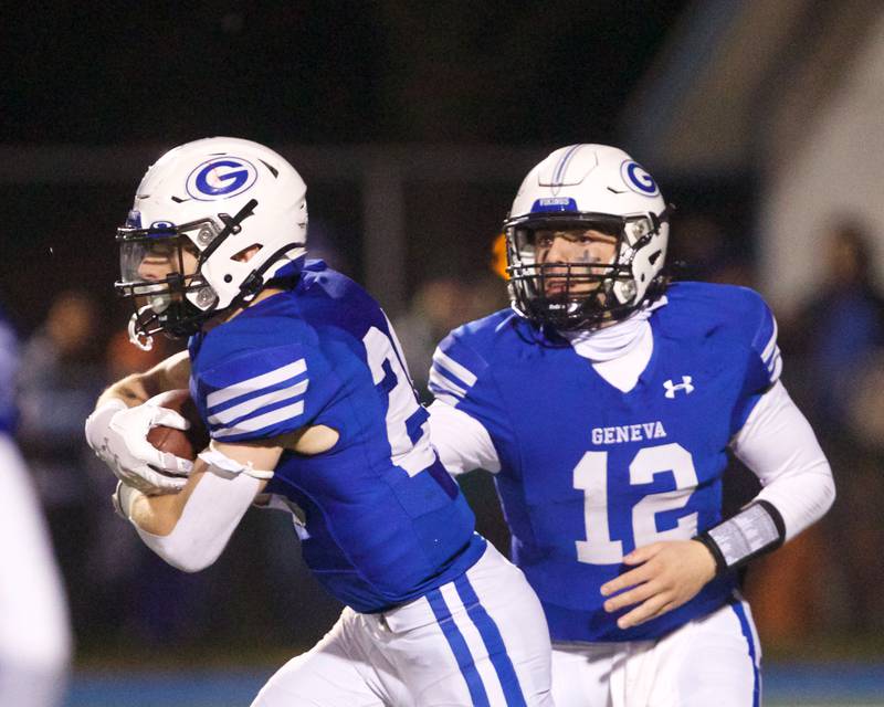 Geneva's Anthony Chahino hands the ball off to Michael Rumoro against Burlington Central at the Class 6A second-round playoff game on Saturday Nov.9,2024 in Geneva.