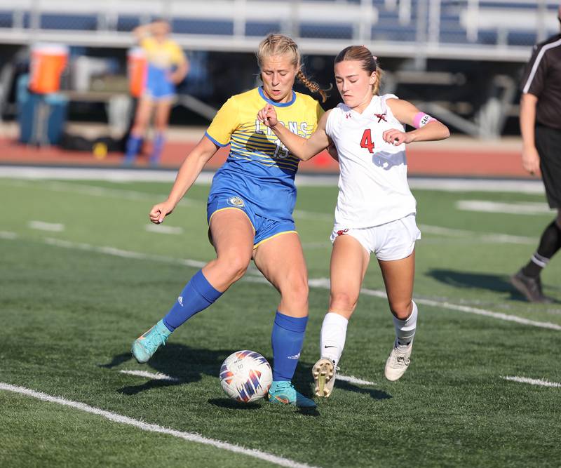 Lyons Township's Zibby Michaelson (15) and Hinsdale Central's Carter Knotts (4) fight over the ball during the IHSA Class 3A girls soccer sectional final match between Lyons Township and Hinsdale Central at Reavis High School in Burbank on Friday, May 26, 2023.