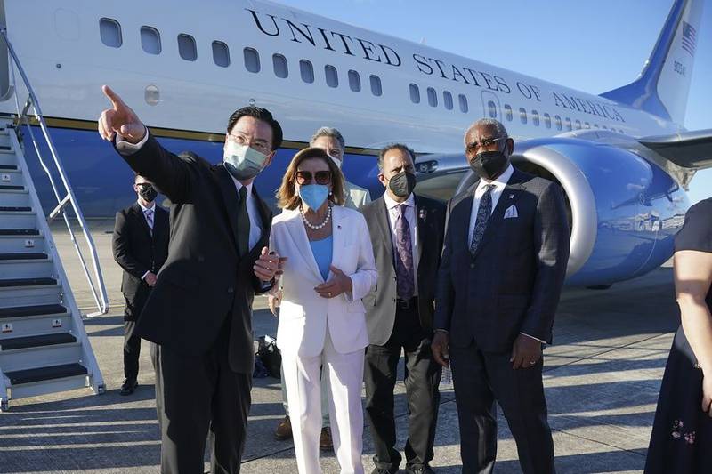 Taiwan Foreign Minister Joseph Wu, left, gestures while speaking with U.S. House Speaker Nancy Pelosi as she prepares to leave Taipei, Taiwan, on Aug. 3. Congressman Raja Krishnamoorthi of Schaumburg is second from right. (Courtesy of Taiwan's Ministry of Foreign Affairs)