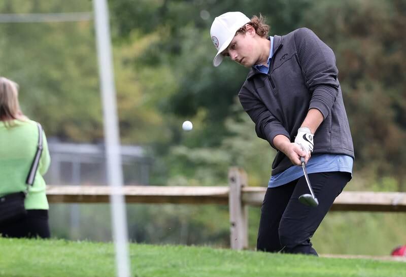 Burlington Central’s Matthew Kowalik chips onto the ninth green Wednesday, Sept. 27, 2023, during the Class 2A boys golf regional at Sycamore Golf Club.