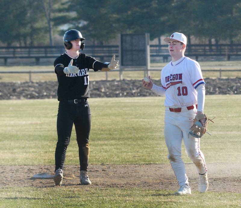 Harvard's Cole Coffer appeals to the umpire after being tagged by Oregon's Keaton Salsbury on Monday, March 23, 2026 at Oregon High School.